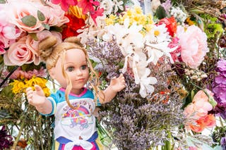 A doll is seen on a memorial wall dedicated to the victims of the July 4 floods in Kerrville, Texas, on July 13